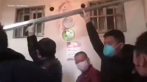 wuhan metal box|Screaming woman in metal box filmed on way to coronavirus .